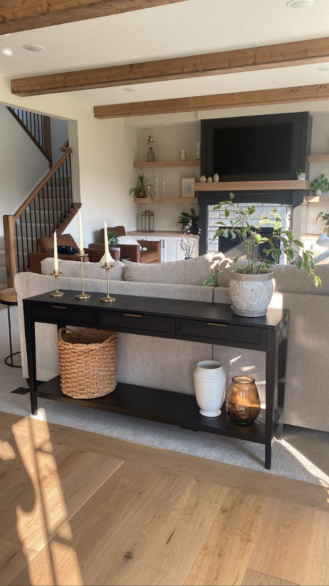 a living room filled with furniture and a flat screen tv