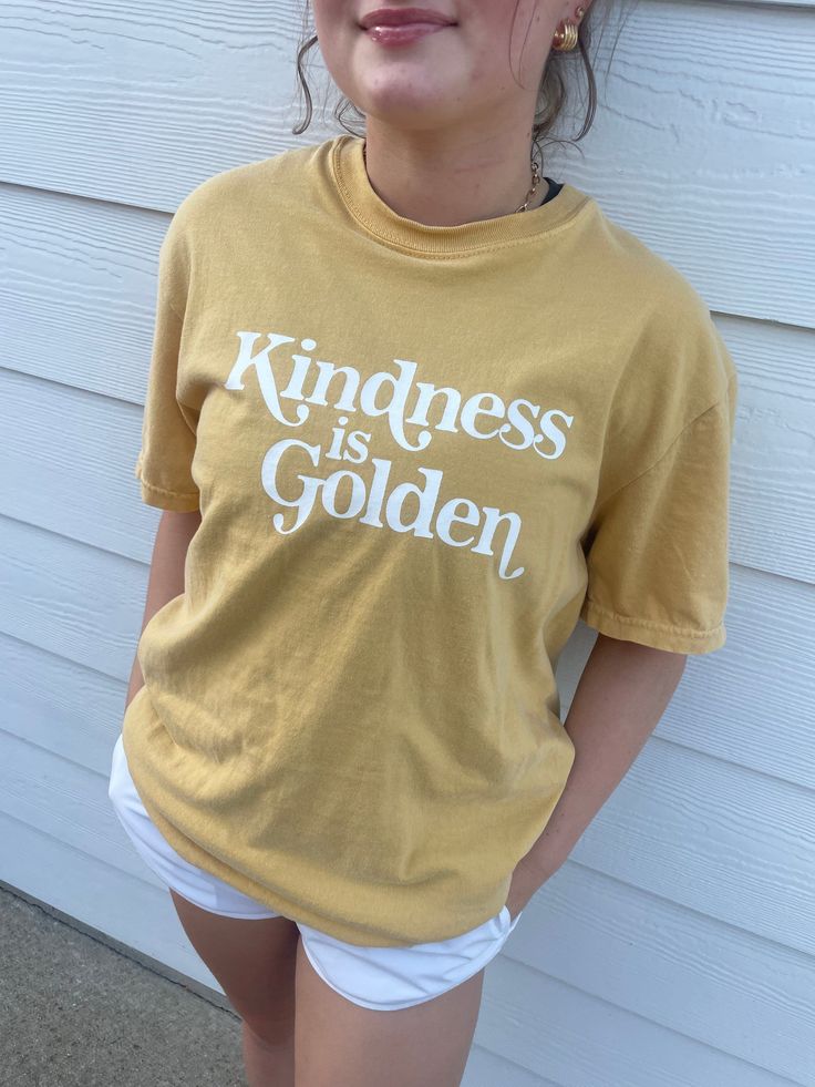 Kindness is Golden T-Shirt. It's printed on the comfiest Comfort Colors tee, with the perfect vintage look. True to size or size up to rock the oversized look. You can select the size and shirt color and we will make this shirt just for you. Please allow 2-3 weeks for your order to ship out. Gold Shirt, Oversized Look, Comfort Colors Tee, Vintage Look, Shirt Color, 3 Weeks, Vintage Looks, Comfort Colors, Cool T Shirts