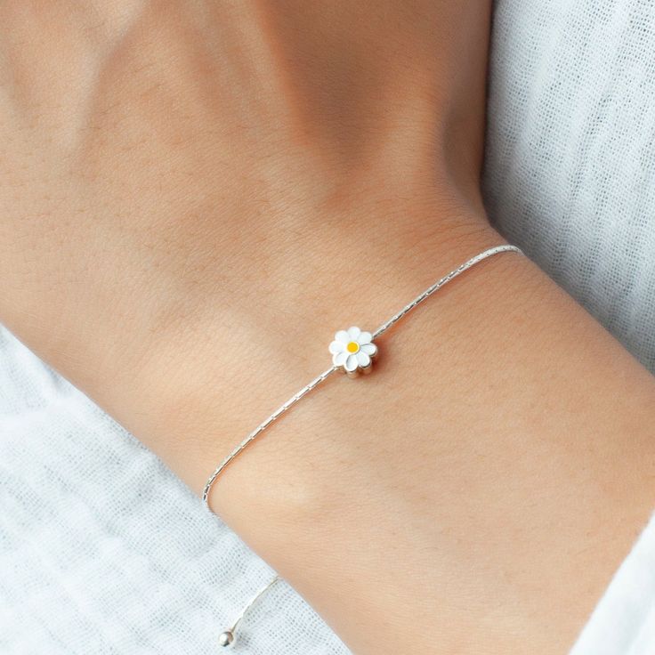 Whether you're looking to treat yourself or searching for the perfect gift, our Daisy Jewelry eloquently embodies the timeless allure of nature's beauty. Crafted with high-quality materials to ensure durability and longevity. ♥ 925 Sterling Silver ♥ Bracelet diameter 9 inches ♥ Necklace chain is 16 inches long ♥ Sizing: Adjustable ♥ Makes a great gift for birthdays, Valentine's day, anniversaries or any other special occasions. Your bracelet arrives beautifully packaged. Perfect for gift-giving, Silver Flower Jewelry For Friendship, Adjustable Round Sterling Silver Bracelet For Gifts, Adjustable Sterling Silver Bracelet As A Gift, Dainty White Round Charm Bracelet, Adjustable Sterling Silver Round Bracelet As A Gift, Adjustable Round Sterling Silver Bracelet As Gift, White Minimalist Bracelet Jewelry, Delicate Jubilee Bracelet Jewelry For Gift, Minimalist White Bracelet Jewelry