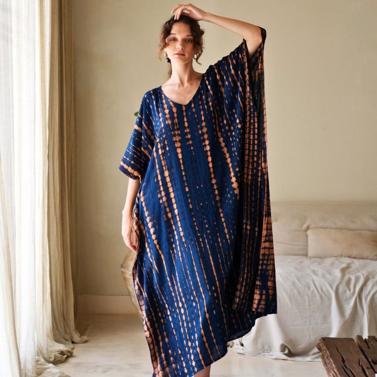 Stand out with this head-turning V-neck sweeping silhouette, this kaftan dress calls to mind dreamy days spent at home or going to a yoga class.  This one-size-fits-most approach will flatter many figures with our everchanging sizing.   We created garments that are meant to last season after season. Each garment is carefully tailored made by our small team of women artisans in Bali from the comfort of their own homes.  100% Rayon. Handmade with love. Handwash cold. Lay flat to dry. 100% Rayon. June Birthstone Jewelry, Gifts For New Mums, Pearl Jewellery Earrings, Jewelry Ring Box, Kaftan Dress, Women Artisans, June Birth Stone, Yoga Class, Independent Designers Fashion