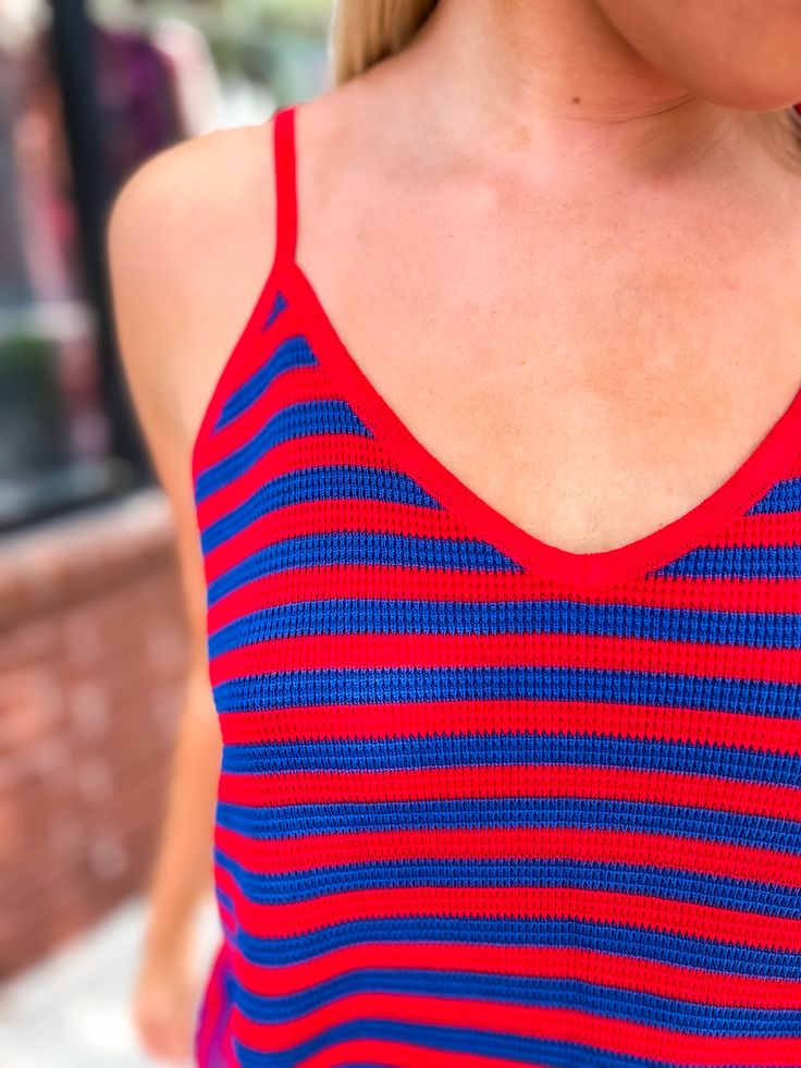 Step up your game day attire with our Striped Flare Cami in Cherry! Made for KU game days with its bold and vibrant stripes. Show off your team spirit in style with this must-have piece that will elevate any outfit. Get ready to cheer loud and proud! GO JAYHAWKS!!! Sporty Striped V-neck Top, Summer Sports Tops With Contrast Stripes, Summer Sports Top With Contrast Stripes, Red Summer Game Day Tops, Sporty Summer Tops With Contrast Stripes, Sporty Tops With Contrast Stripes For Summer, Sporty Contrast Stripes Tops For Summer, Multicolor Striped Top For Summer, Collegiate Red Summer Tops