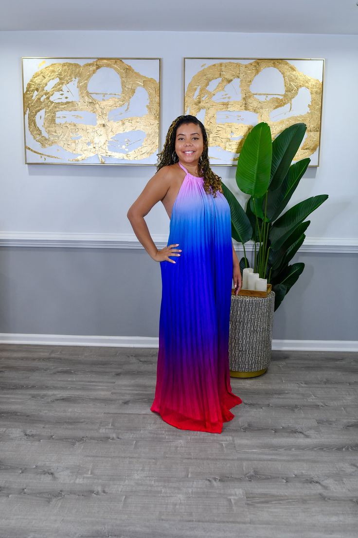 This halter maxi dress features a striking combination of royal blue and magenta hues, creating a vibrant and eye-catching look. The halter neckline adds a touch of elegance, while the flowing silhouette ensures comfort and movement. Perfect for making a statement at any special occasion or summer event. Oversized Model is wearing a small with plenty of room left 100% Polyester Model wearing a small Vibrant Summer Maxi Dress For Parties, Vibrant Blue Maxi Dress For Party, Multicolor Halter Neck Maxi Dress For Party, Elegant Multicolor Halter Neck Maxi Dress, Floor-length Halter Dress For Night Out In Summer, Flowy Pink Maxi Dress For Night Out, Vibrant Summer Party Maxi Dress, Summer Party Vibrant Maxi Dress, Vibrant Pink Maxi Dress For Party