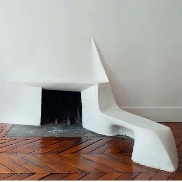 a white sculpture sitting on top of a wooden floor