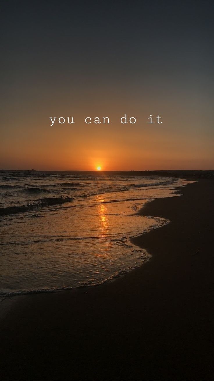 the sun is setting over the ocean and you can do it quote on the beach