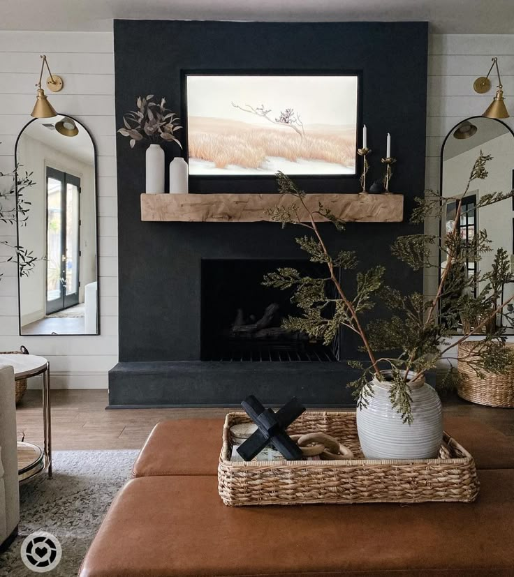 a living room with a couch, coffee table and fireplace