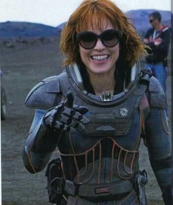 a woman in a space suit and sunglasses