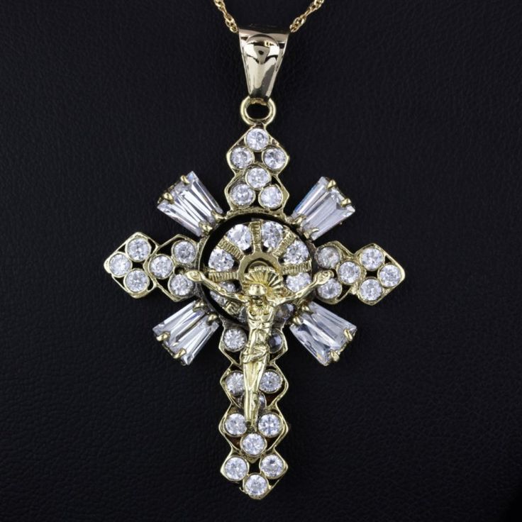 14k Yellow Gold Cz Cubic Zirconia Jesus Crucifix Spinner Pendant Charm This 14k Yellow Gold Cz Cubic Zirconia Jesus Crucifix Spinner Pendant Charm Is A Unique And Eye-Catching Piece. Crafted From 14 Karat Yellow Gold, It Features A Prominent Jesus Figure Surrounded By 46 Round-Cut Cubic Zirconia Stones In Various Settings. The Spinner Feature Allows The Halo Behind The Jesus Figure To Spin, Adding An Intriguing Element To The Design. The Bail Is Suitable For Most Chain Sizes And Is Stamped 14k And "Mexico." Please Note That The Chain Is Not Included. Metal: Pendant Is 14 Karat Yellow Gold Gemstones: 46 Round-Cut Cubic Zirconia Stones Pendant Size: 2.15" Height X 0.80" Weight Weight: 6.04 Fine Jewelry Cubic Zirconia Crucifix, White Cubic Zirconia Jewelry With Rhinestones, Cubic Zirconia Crucifix Jewelry Gift, Cubic Zirconia Cross Pendant For Wedding, Cubic Zirconia Cross Pendant Jewelry For Weddings, White Cubic Zirconia Crucifix Jewelry, Wedding Jewelry: Cubic Zirconia Cross Pendant, Crucifix Cubic Zirconia Diamond Cut Necklace, Cubic Zirconia Crucifix Necklace With Diamond Cut