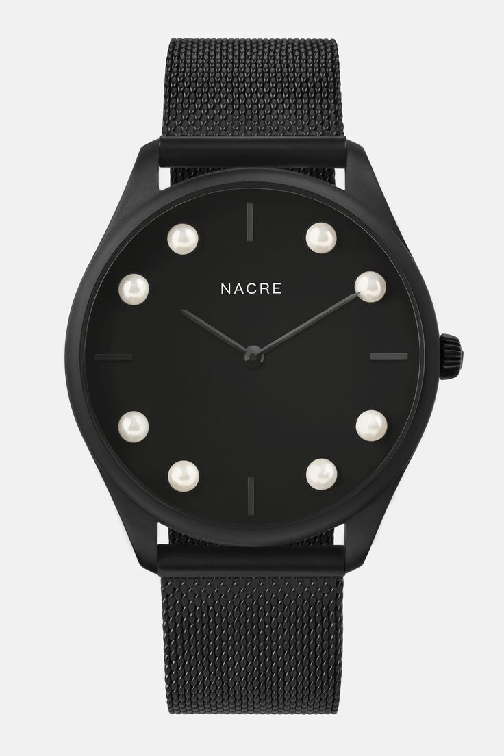 A minimal, modernist watch with a black, sandblasted dial. Eight Cabochon pearls have been hand-set on the face of the watch, marking the eight lunar phases. Paired with a matte black mesh strap. Lunar Phases, Minimalist Watch, Saddle Leather, Stainless Steel Mesh, Steel Mesh, Navy Leather, Black Stainless Steel, Black Mesh, Black Rose