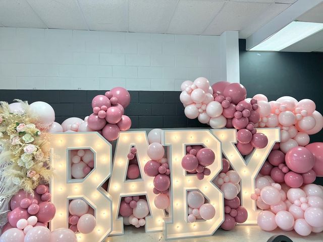 the letters baby are made out of balloons