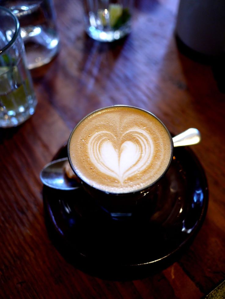 there is a cappuccino with a heart on it