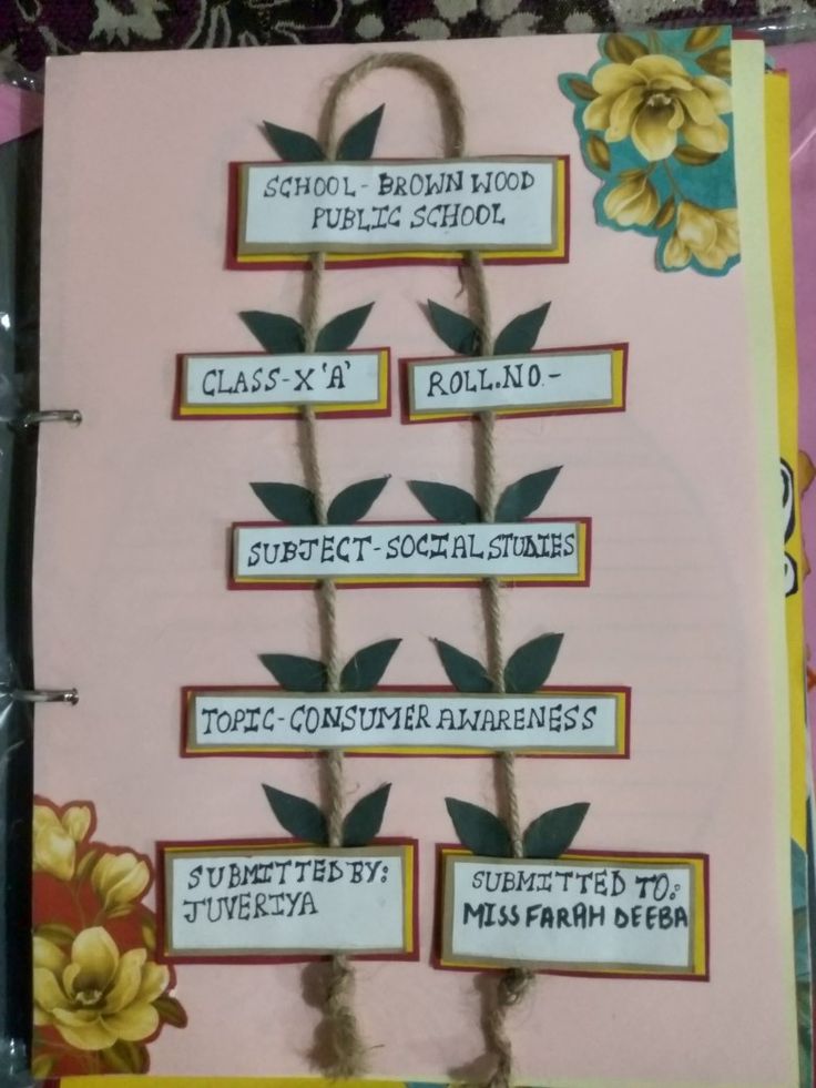 a binder with some writing on it and flowers in the middle, along with other words