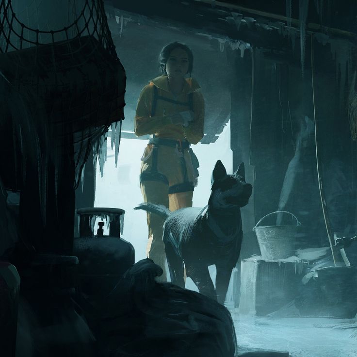 a woman standing next to a dog in a dark room