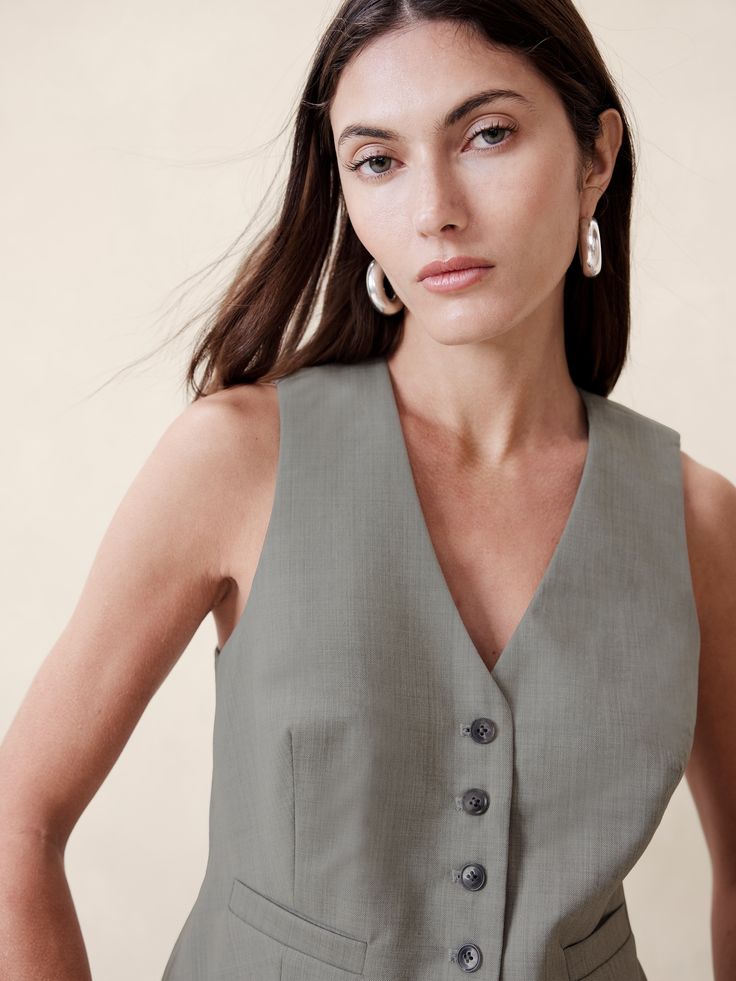 A tailored suit vest, this piece is crafted from our signature Siena Italian wool, selected for its all-weather weight and hint of stretch.  Semi-fitted Fabric sourced from Italy's Marzotto Mill.  V-neck with button-front closure.  Adjustable tabs at waist.  Front pockets.  Fully lined.  Semi-fitted.  Sleeveless.  Above-hip length.  Body length (size S): Regular 21" Model: Size S, 5'10" (178cm). Tailored Suit, Wool Vest, Photography Work, Suit Vest, Siena, Hip Length, Everyday Look, New Color, Banana Republic