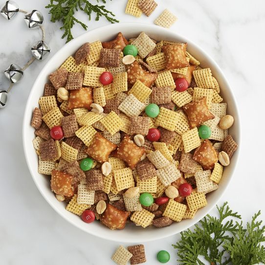 a white bowl filled with cereal and candy