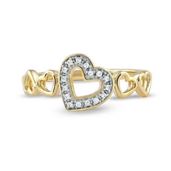 Plan to stand out for your sweet style when you wear this charming diamond tilted five-heart ring in gold-plated silver. Crafted in sterling silver with 14K gold plate A tilted heart-shaped outline shimmers with diamonds at the center. Polished open hearts shine along the shank in a playful pattern. This ring sparkles with 1/20 ct. t.w. of diamonds. Diamond Heart Ring Hallmarked, Diamond Heart Cut Ring Hallmarked, Heart-shaped Hallmarked Diamond Ring, Valentine's Day Diamond Heart Ring, Hallmarked, Valentine's Day Diamond Heart Ring Hallmarked, Valentine's Day Hallmarked Diamond Heart Ring, Sterling Silver Heart Cut Yellow Gold Diamond Ring, Yellow Gold Heart Ring With Diamond Accents For Promise, Gold Heart-shaped Ring With Single Cut Diamonds