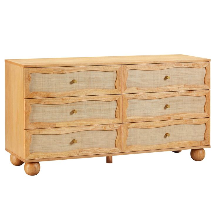 a wooden dresser with four drawers on wheels