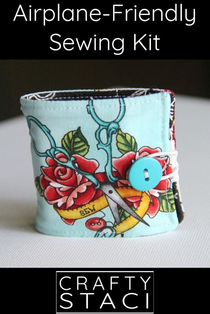 there is a small cuff with scissors and flowers on the front, and a blue button in the middle