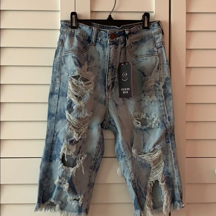 Distressed Light Denim Shorts Trendy Ripped Faded Bottoms, Trendy Distressed Straight Leg Shorts, Trendy Straight Leg Distressed Shorts, Blue Distressed Jean Shorts, Blue Ripped Denim Jean Shorts, Ripped Blue Short Jeans, Trendy Faded Ripped Bottoms, Short Length Distressed Blue Jeans, Trendy Ripped Blue Jean Shorts