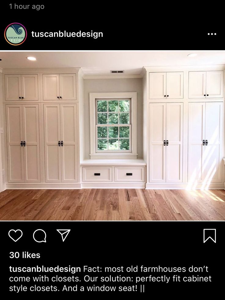 an empty room with white cabinets and wood flooring is featured in the instagram