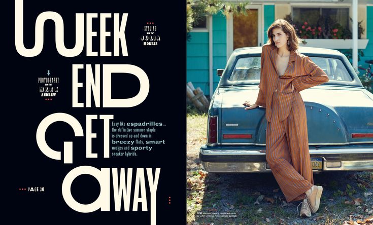 a woman leaning on the back of a car in front of a blue house with an advertisement for queen end getaway