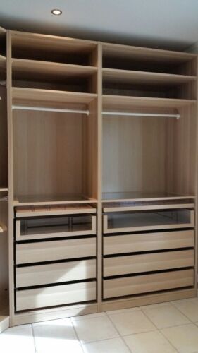 an empty walk in closet with lots of drawers