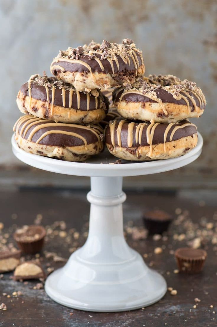 chocolate covered cookies on a white cake plate