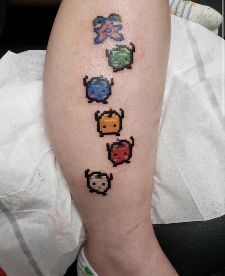 a person with a pixel tattoo on their leg