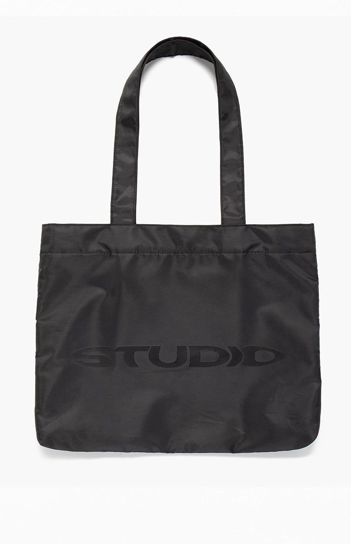 Studio by Supervsn introduces their classic Tote Bag to keep everything you need in one place. With a roomy main compartment, mesh zipper pouch, and iconic logo graphic, this tote bag makes for a functional and cool piece for your streetwear style. 


	Solid color tote bag
	Fixed straps
	Roomy main compartment
	Snap-button closure
	Mesh zipper pouch
	Logo graphic


4% of net proceeds from each Studio Powered by Supervsn product purchased will be donated to the Living Through Giving Foundati Mens Tote Bag, Classic Tote Bag, Iconic Logo, Streetwear Style, Shopping Tote Bag, Logo Graphic, Pacsun, Zipper Pouch, Snap Button