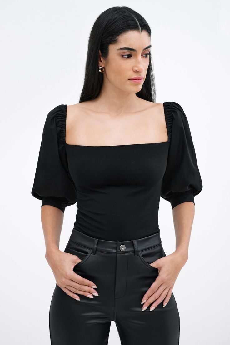 Our Alana Top is an ode to love. A day-to-night romantic look, her fitted bodice in high-stretch and sustainable European jersey features a square neck that gracefully frames your face and neck, while billowy mid-length sleeves in European poplin cotton are punctuated by mother-of-pearl button cuffs for a poetic finish. Sister to our Shira Top Alana's double-layered for comfort and support.[SPLIT] Shannon, in off white, is 5'8" (173 cm) tall, wearing a size M. Maritza, in off white, is 5'9" (177 Square Neck Puff Sleeve Top, Top Summer Outfits, Tunic Hoodie, Mid Length Sleeves, Puff Sleeve Top, Fitted Bodice, Mid Length, Square Neck, Work Outfit