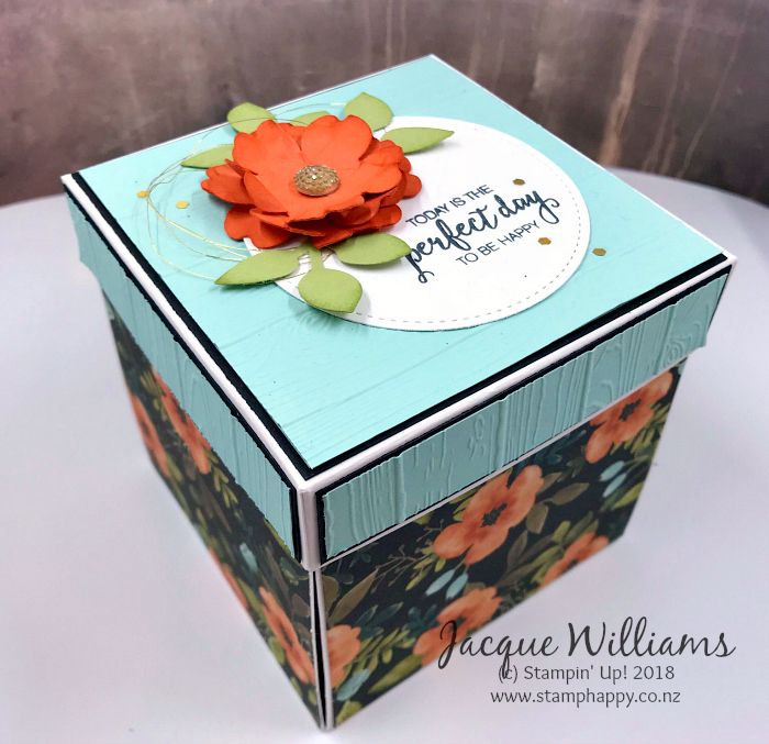 a small box with a flower on it