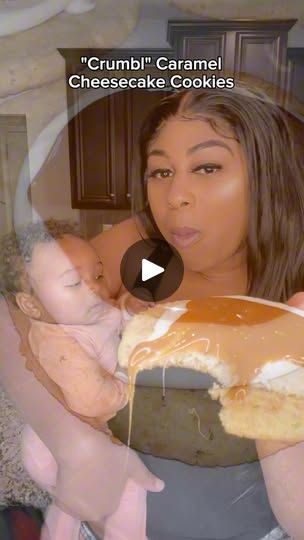 a woman holding a baby in her arms while she is covered with caramel cheesecake cookies