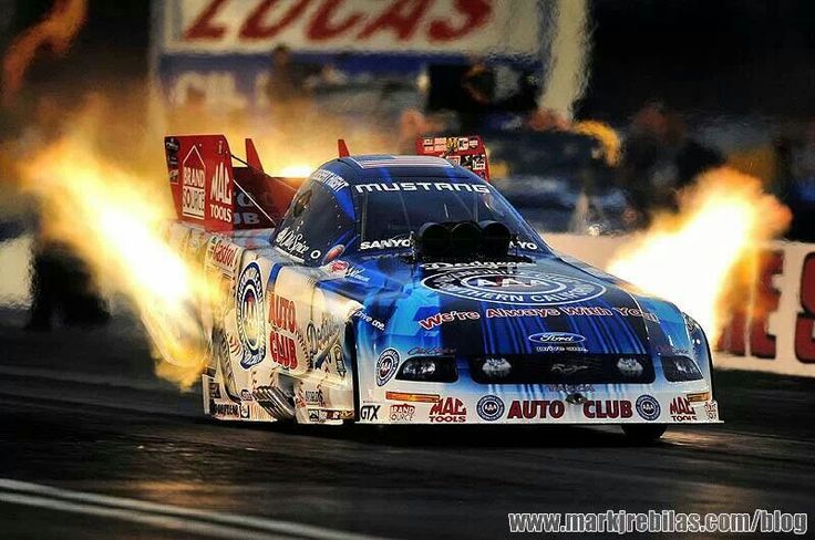 a drag car with flames coming out of it