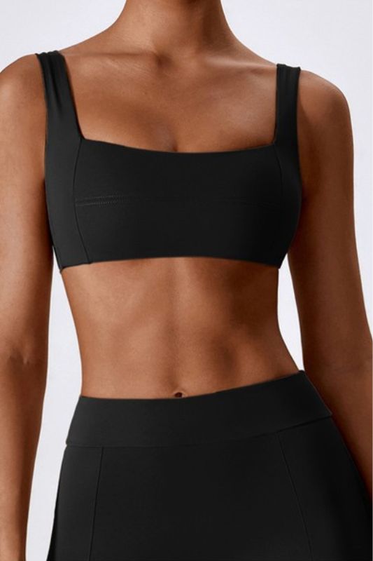 Made from the highest quality fabric, this bra offers superior comfort and support during even the most intense workouts. The edgy design features sleek lines and a flattering cut that perfectly complements your curves, while the moisture-wicking material keeps you cool and dry. With this sports bra, you can be confident that you're getting the perfect combination of fashion and function. Whether you're hitting the gym or going for a run outside, this bra is the perfect addition to your workout Contoured Sports Bra With Built-in Padding For Gym, Black Sculpting Activewear With Built-in Bra, Sporty Sports Bra For Pilates With Wide Straps, Fitted Activewear With Wide Straps For Training, Sleek Nylon Activewear For Sports, Sleek Nylon Sports Activewear, Wide Straps Seamless Sports Bra For Gym, Seamless Sports Bra With Wide Straps For Gym, Black Sports Bra With Seamless Construction And Wide Straps