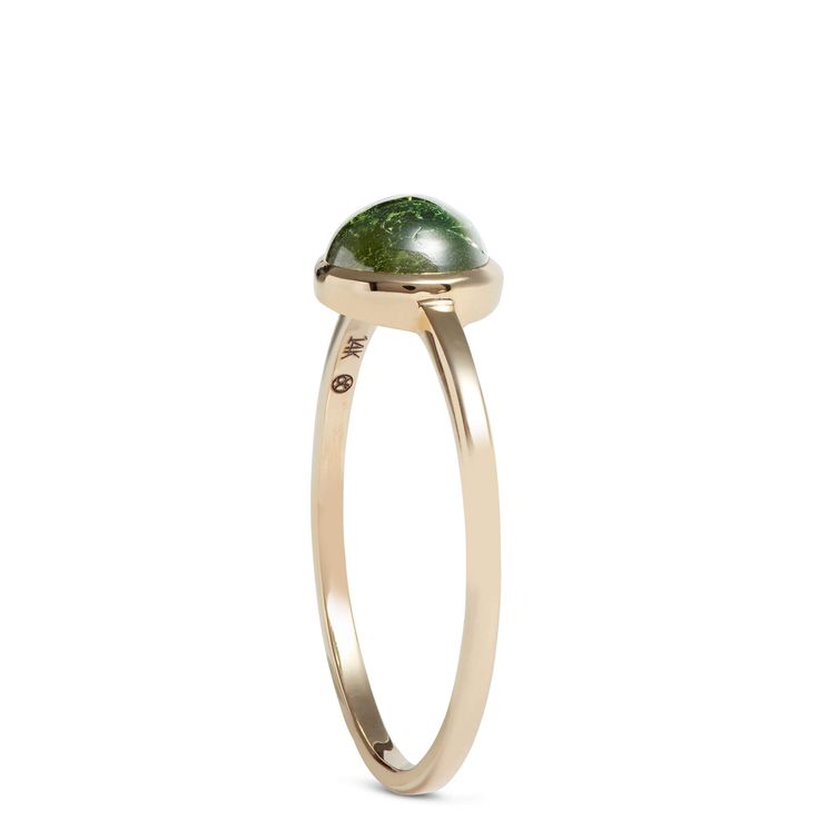 Every gemstone has something special and our captivating round tourmaline ring is no exception. The center stone is bezel set in 14k yellow gold to beautifully complement the stunning shade of green and intricate patterns that make each ring as unique as you. It’s part of our Lisa Bridge Collection, which she designed to be a staple for your jewelry wardrobe. This ring is made to be stacked and styled in a way that reflects everything that makes you one-of-a-kind. 14k Gold Green Gemstone Dome Ring, Green Tourmaline Ring, Jewelry Wardrobe, Engagement Rings Bridal Sets, Popular Jewelry, Tourmaline Ring, Brown Diamond, Ring Size Guide, Green Tourmaline