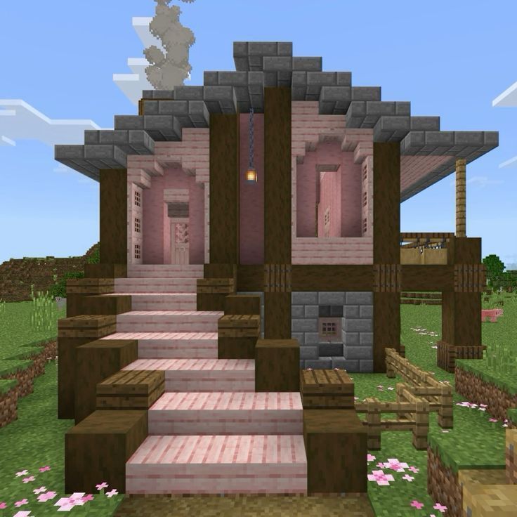 an image of a house in minecraft with steps leading up to the front door