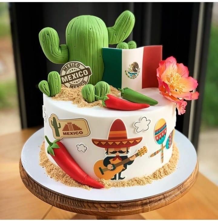 a mexican themed cake on a wooden table