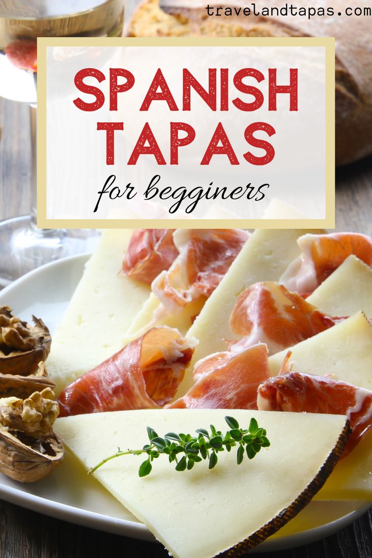 spanish tapas for beginners on a white plate with mushrooms and parmesan cheese