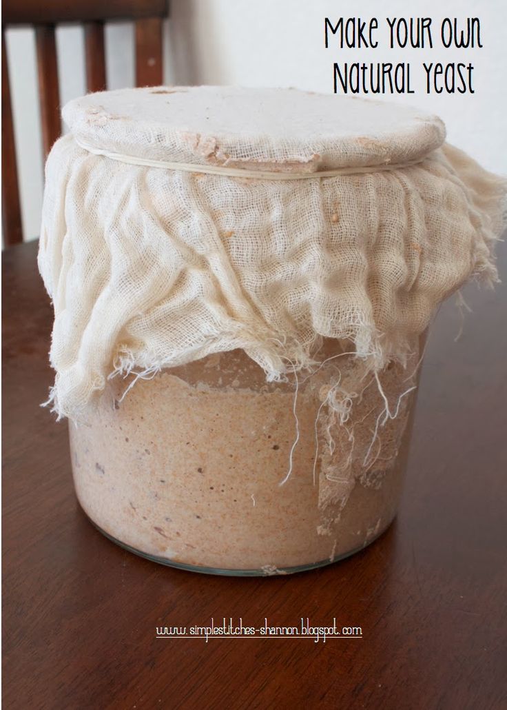 a jar filled with white stuff sitting on top of a wooden table