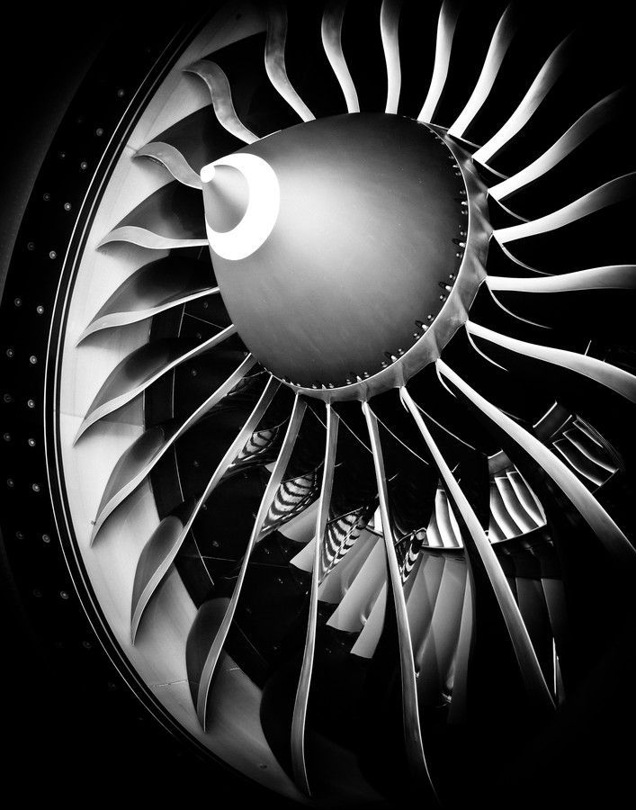 an airplane's turbine is shown in black and white