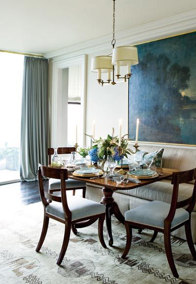 a dining room table is set with plates and silverware