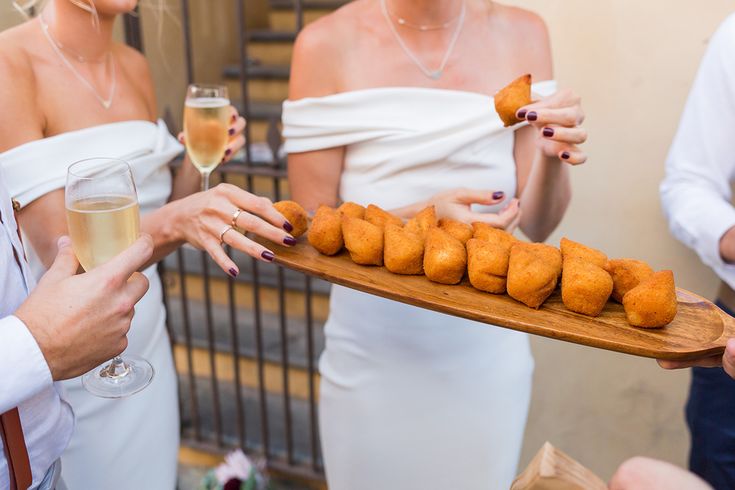 a woman holding a tray with some food on it