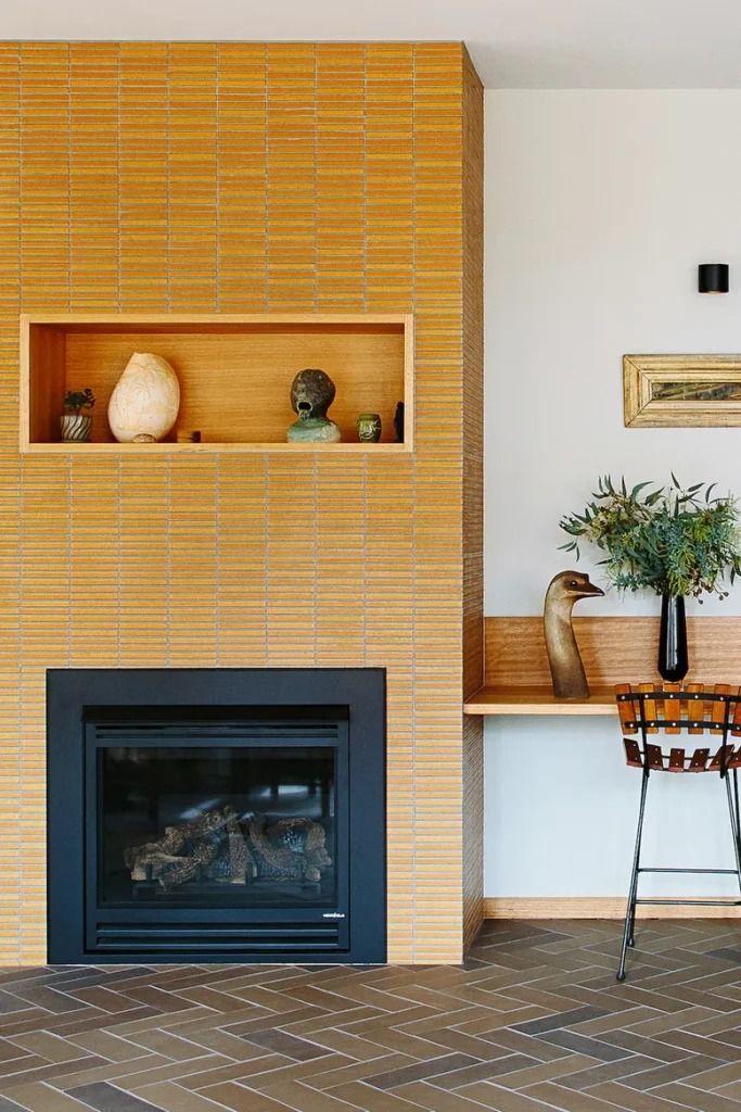 a living room filled with furniture and a fire place next to a wall mounted tv