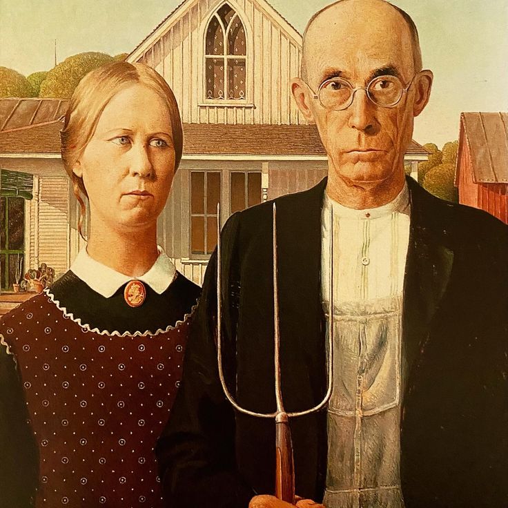 an old man and woman standing in front of a house with a large garden fork