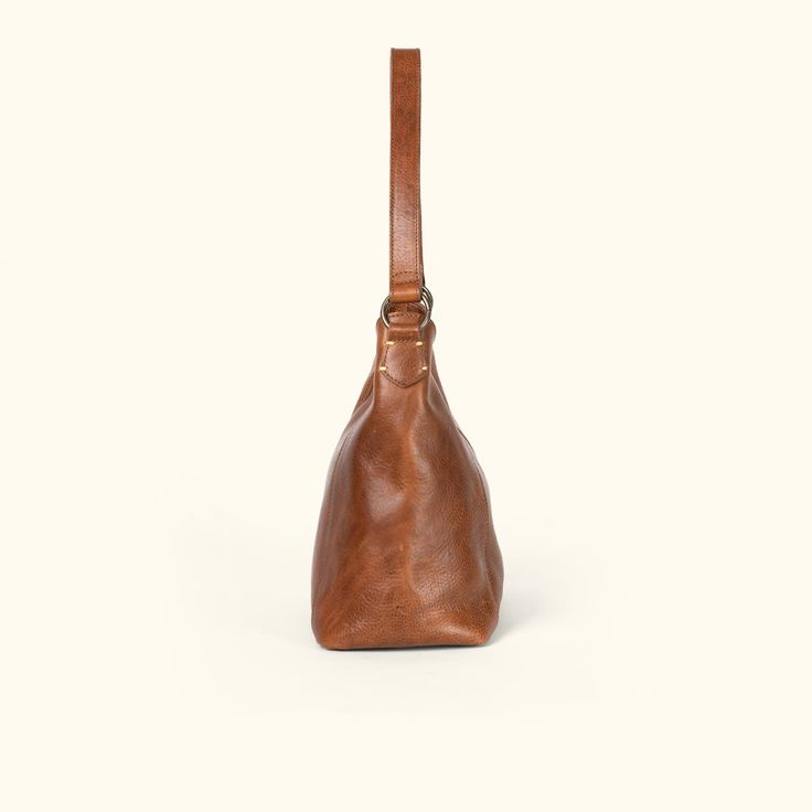 Walker Leather Shoulder Bag | Rustic Tan hover On-the-go Satchel Shoulder Bag With Brass Hardware, Timeless Everyday Saddle Bag With Removable Pouch, Timeless Everyday Saddle Shoulder Bag, Timeless Brown Flap Bag For Everyday Use, Timeless Saddle Shoulder Bag For Everyday, Timeless Shoulder Saddle Bag For Everyday Use, Classic Soft Leather Saddle Bag For On-the-go, Formal Vegetable Tanned Leather Shoulder Bag, Leather Shoulder Bag With Brass Hardware For Travel