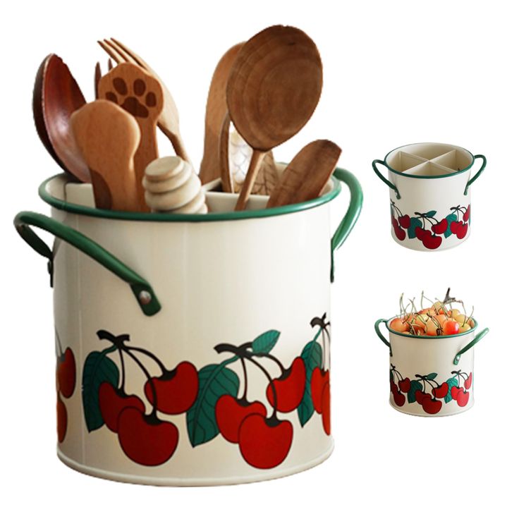 an image of kitchen utensils in a pot with cherries on the side