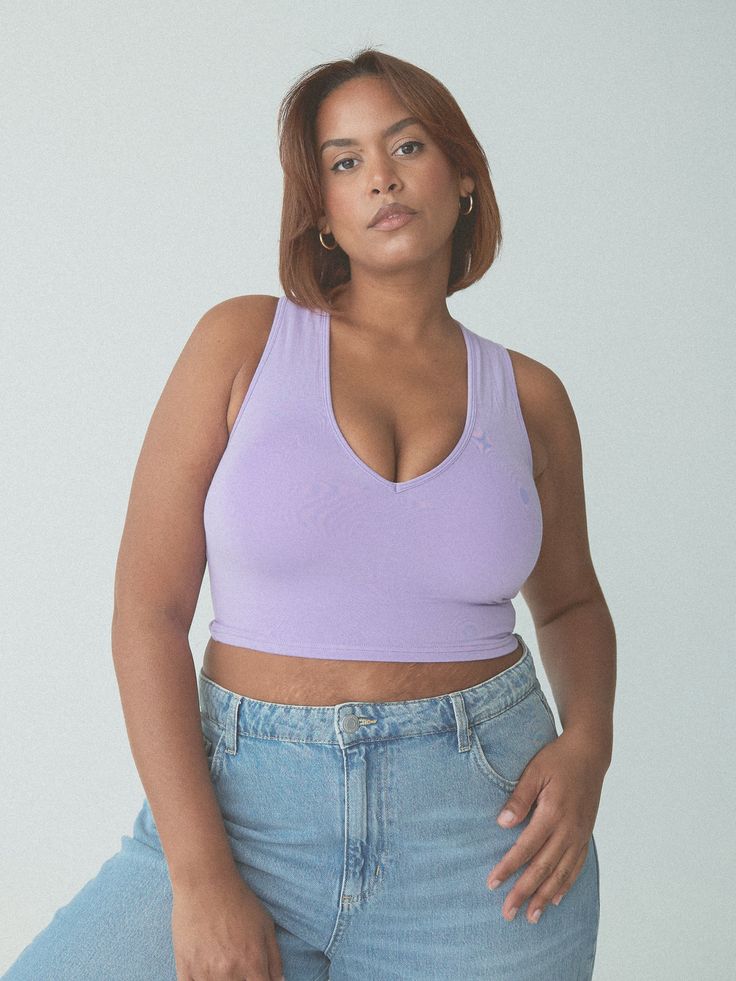 A low v neckline and built-in padding is the perfect match! This crop top is double lined front and back and offers great support with no bra needed. Support Level: Medium to High Fit: True to Size Fabric: 92% Modal, 8% Spandex Internal Structure: Band-less Padding included: Size XXS: Small pads included Size XS-S: Medium pads included Size M-L: Large pads included Size XL: XL pads included Size 2X-3XL: 2XL pads included Separate pad sets are available for purchase on our website - click here Cropped Elastane Sports Bra, Summer V-neck Crop Top, Summer V-neck Crop Top For Workout, Athleisure V-neck Crop Top For Summer, Summer V-neck Athleisure Crop Top, Casual Bra Friendly Low-cut Crop Top, Fitted V-neck Crop Top For Workout, Casual Low-cut Bra-friendly Tops, Casual Low-cut Crop Top With Built-in Bra