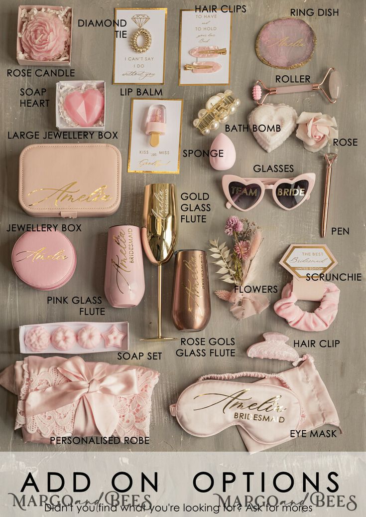 the contents of an assortment of pink and gold items are displayed on a gray surface