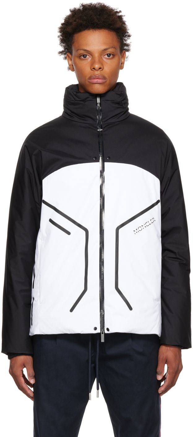 Paneled down-filled nylon taffeta jacket. · Stowaway hood · Logo printed at funnel neck · Two-way zip closure · Zip pockets · Concealed bungee-style drawstring at waist · Rubberized logo patch at sleeve · Elasticized cuffs · Zip pocket at interior · Nylon satin lining Supplier color: Black/White Fill: 90% down, 10% feathers. | Moncler Black & White Barcena Jacket Futuristic Jacket, Mens Ski Wear, Balance Logo, Taffeta Jacket, Sports Wear Women, Fire Fits, Modern Outfits, Sports Jacket, Funnel Neck