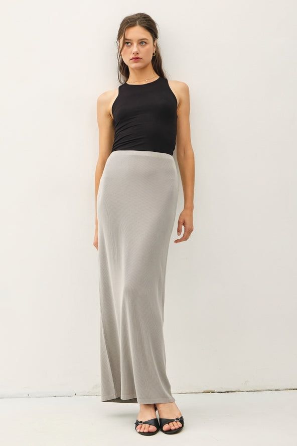 Indulge in luxury with the Be Cool Jersey Knit Maxi Long Pencil Skirt. This ladies skirt features a high rise and a fitted silhouette for a sophisticated look. The ribbed knit fabric and elastic waistband provide comfort while maintaining a lightweight and stretchy feel. Perfect for any casual occasion. Long Pencil Skirt, Be Cool, Fitted Silhouette, Gray Skirt, Knit Jersey, Brown And Grey, Ribbed Knit, Knit Fabric, Pencil Skirt