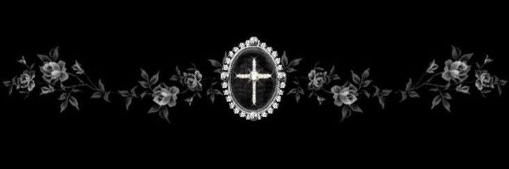 the reflection of a cross in a mirror on a black background with flowers and leaves